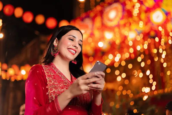 A stylish woman beside vibrant slot machines displaying glowing sevens, showcasing the variety of top slots at SUPERJILI.