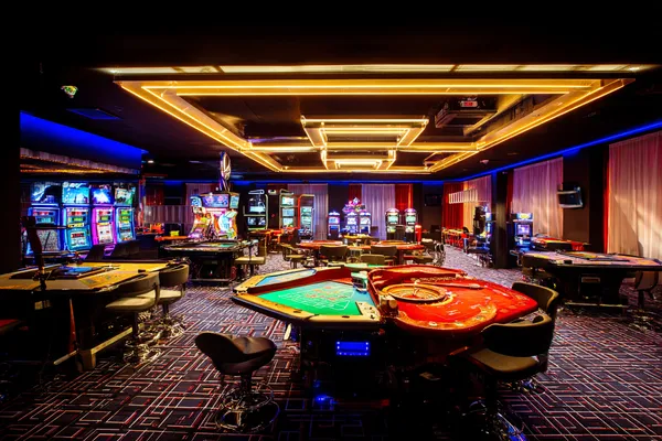 A player using their smartphone during a festive local event, representing SUPERJILI’s fully mobile-friendly casino.