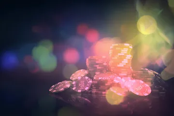 A laptop glowing with a bright login prompt in a minimalistic setup, symbolizing the protected access system at SUPERJILI.